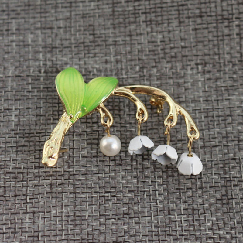 Green drip-glazed lily of the valley brooch