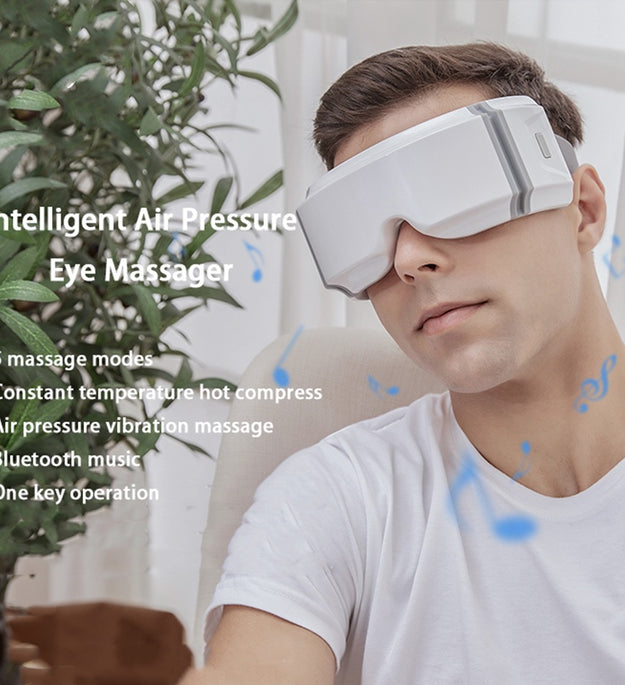 Eye heating eye massager