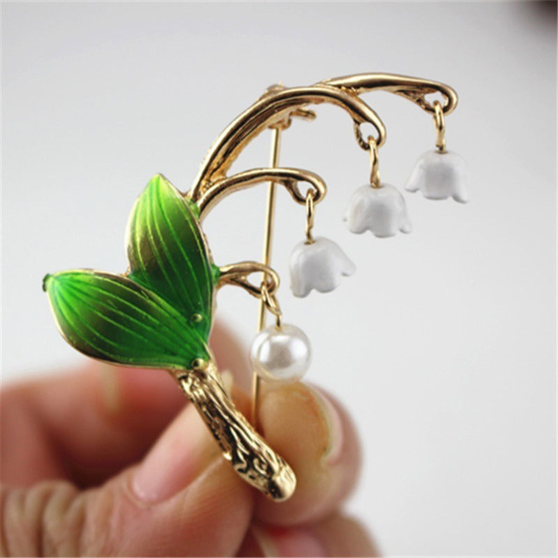 Green drip-glazed lily of the valley brooch