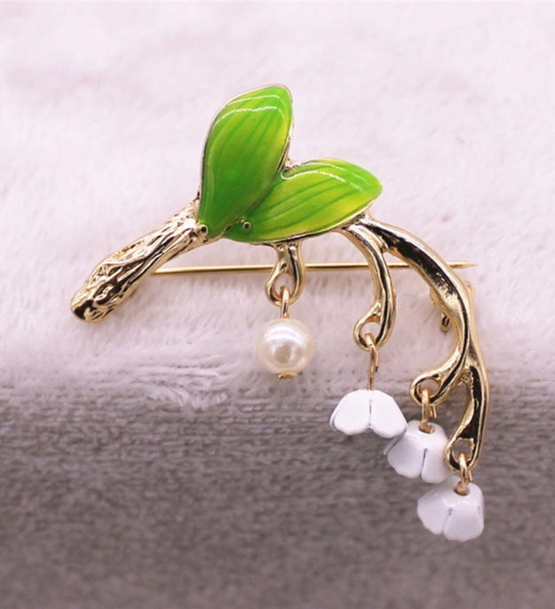 Green drip-glazed lily of the valley brooch