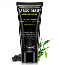 Bamboo charcoal blackhead mask in a black tube with bamboo leaves and charcoal pieces for deep cleansing