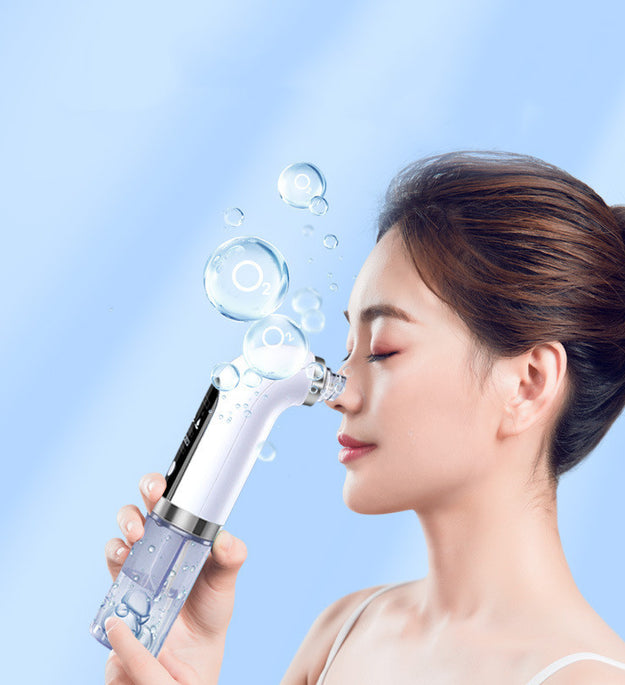 Woman using electric pore vacuum cleaner on her nose with blue background and water bubbles