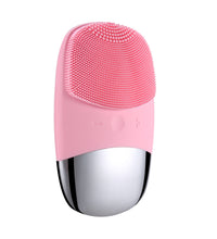 Pink electric silicone face cleansing brush with soft bristles and sleek silver base