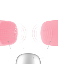 Pink electric silicone face cleansing brush showing soft bristles and vibration indicators