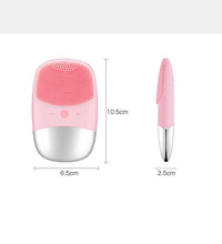 Pink electric silicone face cleansing brush with measurement dimensions shown front and side view