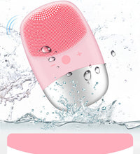 Pink electric silicone face cleansing brush with water droplets and vibration for deep facial cleaning