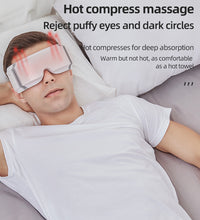 Man lying down wearing an eye heating massager for hot compress massage relieving puffy eyes
