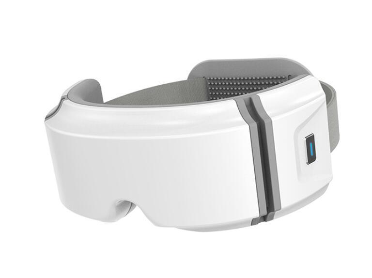 White and gray eye heating massager with adjustable head strap and control button