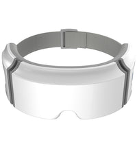 White modern eye heating massager with adjustable gray strap for comfortable fit