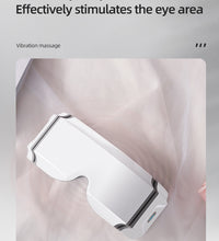 White eye heating massager with multi-frequency vibration to stimulate the eye area effectively