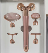 Rose gold 5-in-1 facial massage tool set with multiple interchangeable heads for skincare
