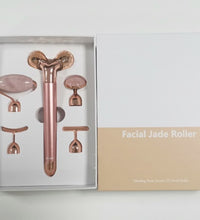 Rose gold 5-in-1 facial massage tool set with various jade roller attachments in white and beige box