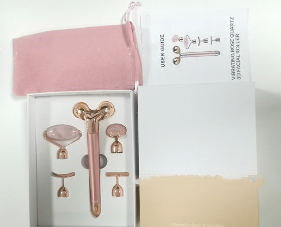 5-in-1 facial massage tool set with rose quartz roller, multiple attachments, user guide, and pink storage pouch