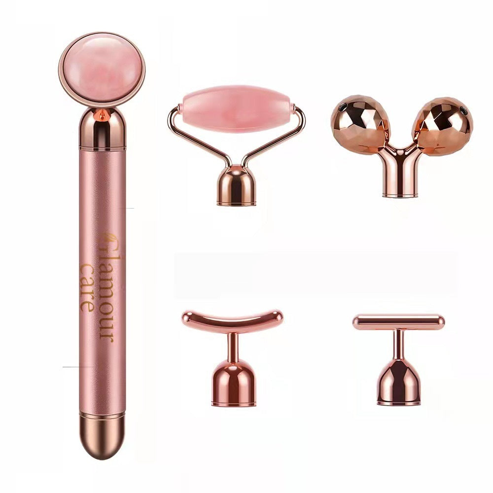 Rose gold 5-in-1 facial massage tool set including roller and various attachment heads for skin care