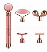 Rose gold 5-in-1 facial massage tool set including roller and various attachment heads for skin care