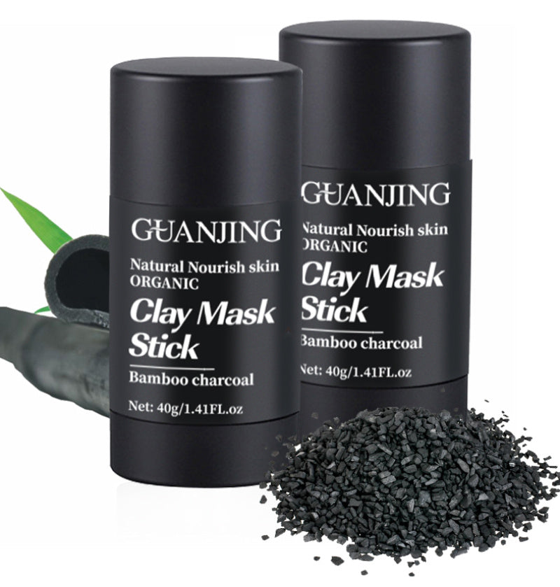 Organic bamboo charcoal face mask clay stick in black container with charcoal pieces
