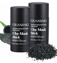 Organic bamboo charcoal face mask clay stick in black container with charcoal pieces