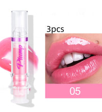 Lip plumper with chili extract in pink shade, shown with glossy lips applying product for volume enhancement