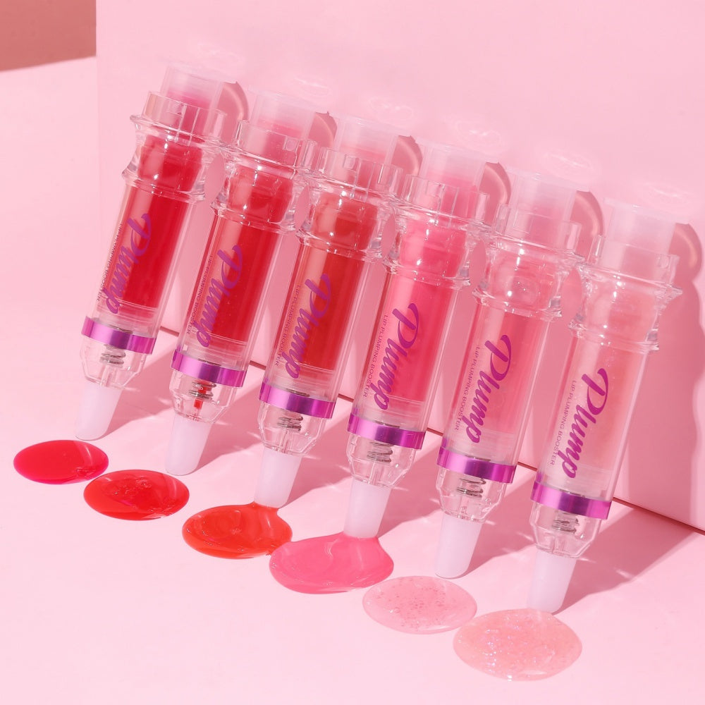 Set of six lip plumper with chili extract tubes in various shades on pink background