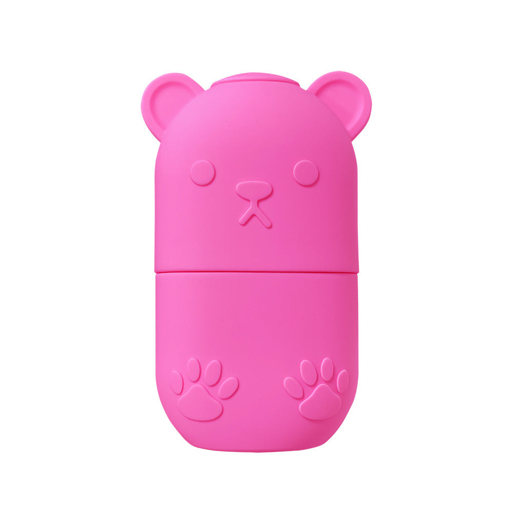 Pink bear-shaped ice face roller for skincare with paw print details on the case