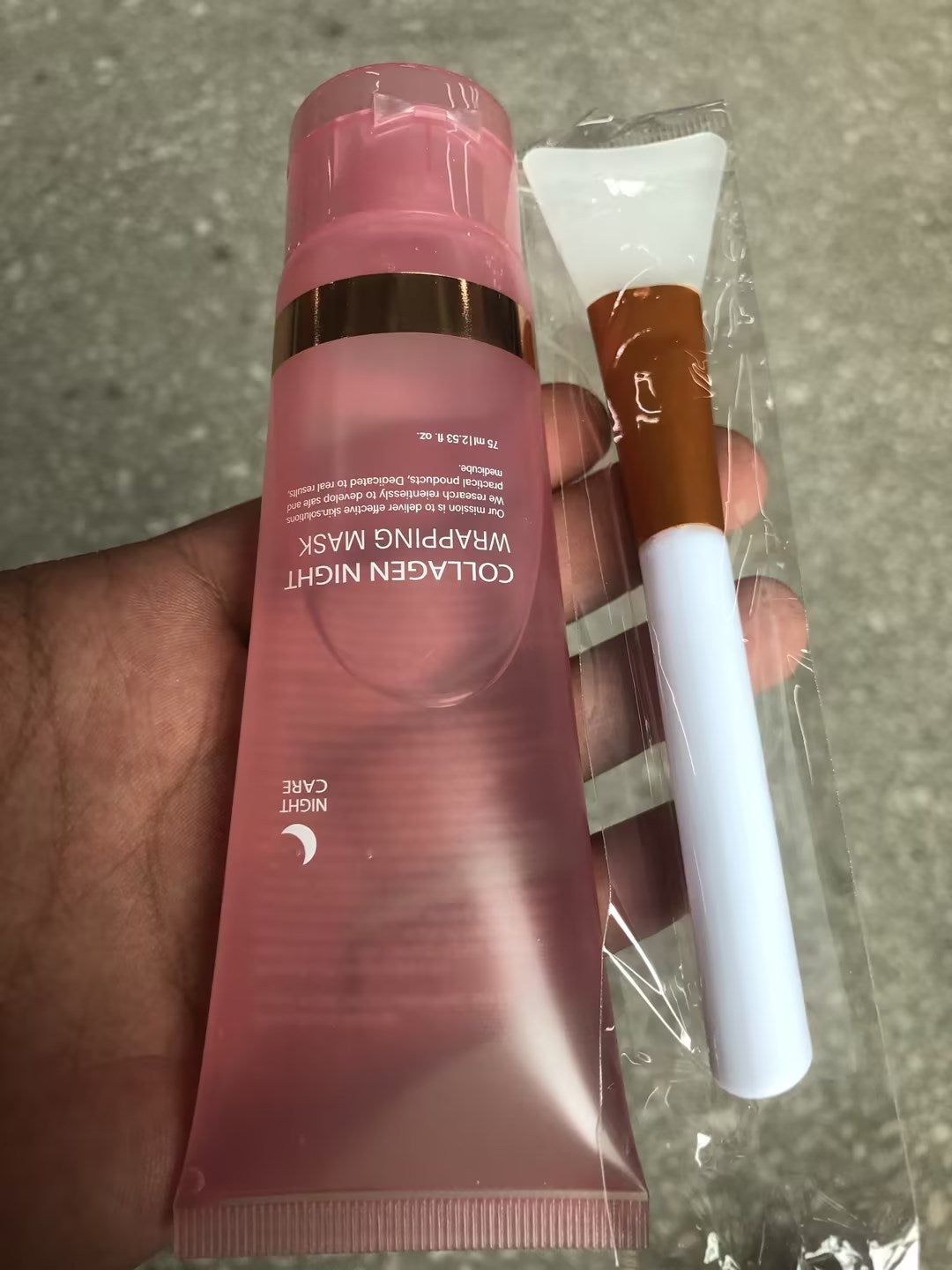 Pink tube of collagen night wrapping mask with applicator for anti-wrinkle overnight mask skincare