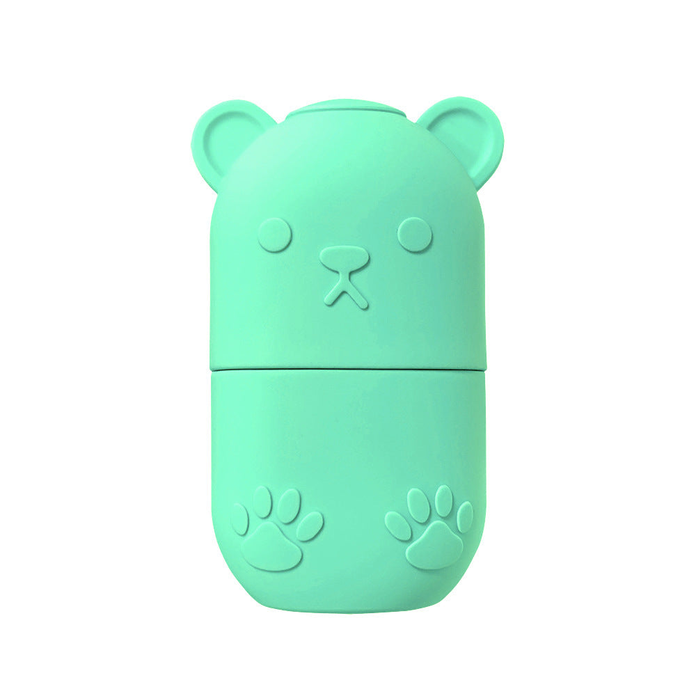 Mint green bear-shaped ice face roller for skincare with embossed paw and nose details