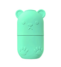 Mint green bear-shaped ice face roller for skincare with embossed paw and nose details