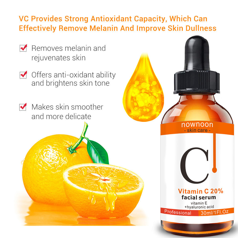 Hyaluronic acid vitamin C serum bottle with orange slice and drop illustrating antioxidant and skin brightening benefits