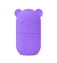 Purple bear-shaped case for ice face roller for skincare with embossed paw and face details