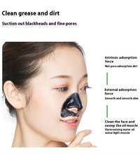 Woman with bamboo charcoal blackhead remover cream mask applied on nose to clean blackheads and dirt