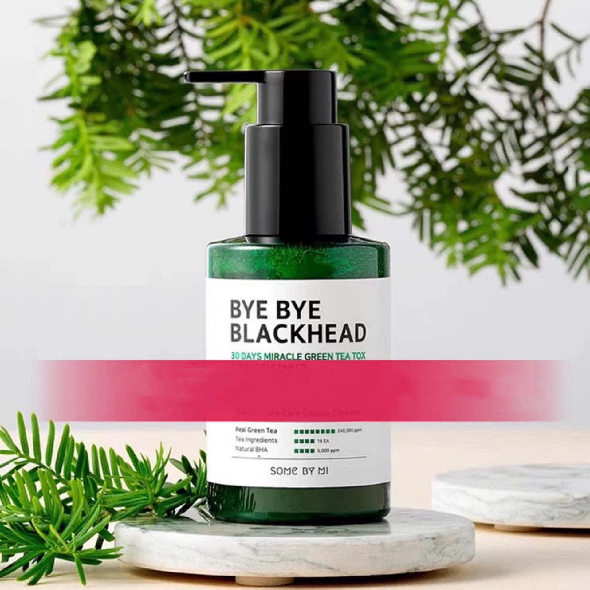 Bye Bye Blackhead green tea facial cleanser in green pump bottle with natural tea leaves background
