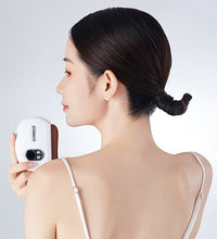 Woman holding a small white device showing the backside view of the zdeer electronic bread maker